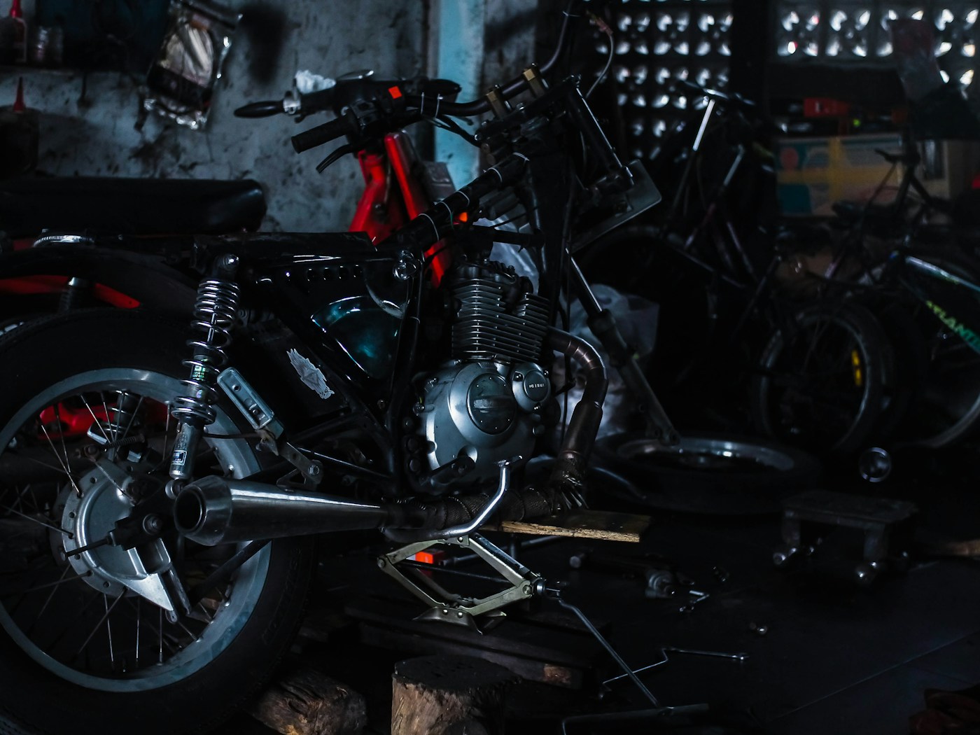 Motorcycle being repaired inside a workshop