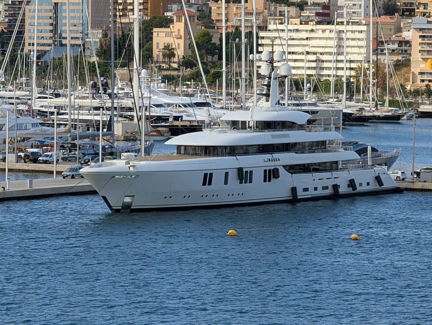 Large yacht docked in a marina